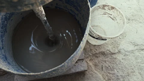 Clay Mud Swirling in an Industrial Ceramic Studio Mixer 動画素材 333599565