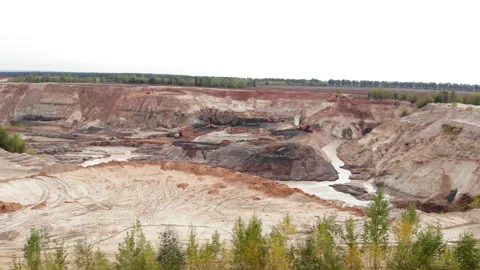 Clay or iron ore mining quarry. Machinery trucks in lithium mine. Large Stock Footage 141290564