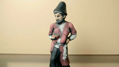 Clay painted bottle of Georgian wine in the form of a man in traditional clothes Stock Footage 121604456
