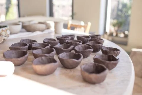 Clay plates on the table, raw texture Stock Photos