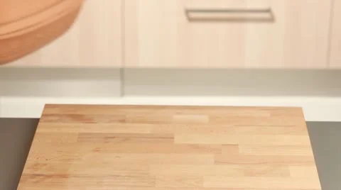 A clay pot lid being turned over Stock Footage 24657827