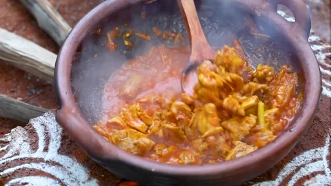 Clay Pot Stew Simmering On Open Fire With Tender Meat Pieces And Steam 스톡 동영상 324784944