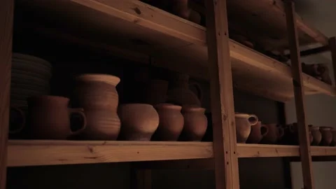 Clay pots are placed on racks in the drying room. Stock Footage 159963464