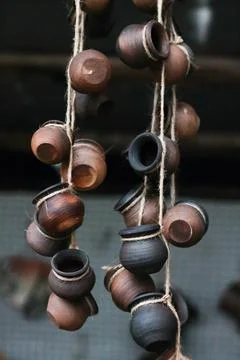 Clay pots hang on a string Stock Photos