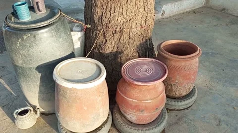 Clay Pots Plastic Drum By Road In Kawaji Stabilized Stock-Footage 321191779