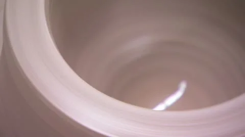 Clay pottery spinning on a wheel Background Loop Video stock 10605035