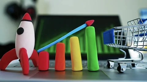 Clay Rocket and Bar Graph Symbolizing Growth, Colorful clay rocket and bar .. 動画素材 304878578