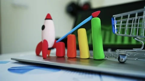 Clay Rocket and Bar Graph Symbolizing Growth, Colorful clay rocket and bar .. Видео 304878724