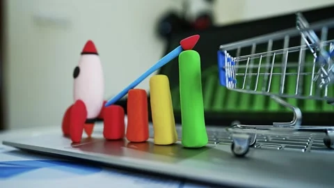 Clay Rocket and Bar Graph Symbolizing Growth, Colorful clay rocket and bar .. Vídeo Stock 304878769