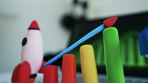 Clay Rocket and Bar Graph on Laptop, Clay rocket and bar graph representing.. 動画素材 304878880