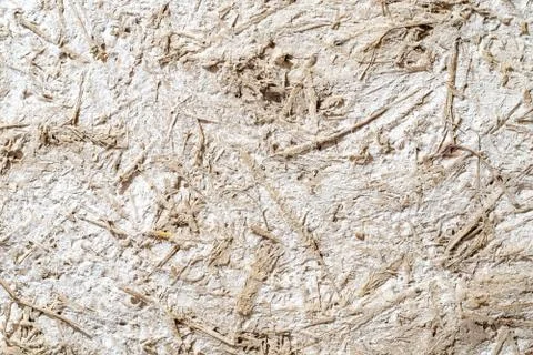 Clay stucco texture with straw. Adobe Stock Photos
