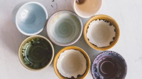 Clay tea cups on a white background close-up. Natural ceramic ware for drinks Stock Photos