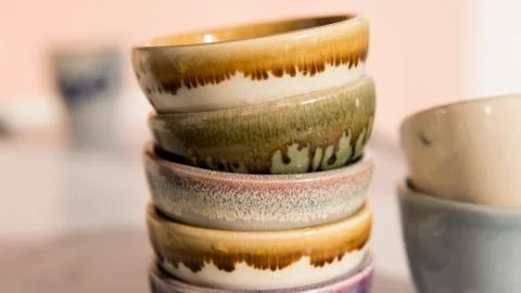 Clay tea cups on a white background close-up. Natural ceramic ware for drinks Stock Photos
