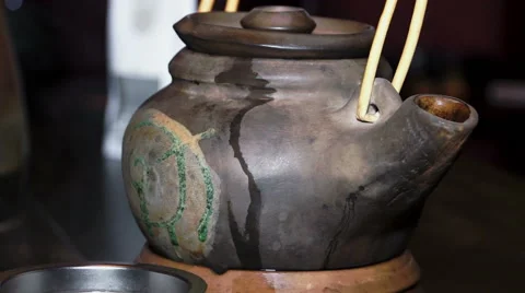 Clay tea pot and tea strainer Stock Footage 60631128