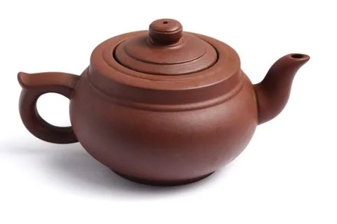 Clay teapot on a white background Stock Photos