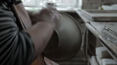 Clay workshop. Full of feminine hands holding a wet rag. Remove the roughnes Video stock 130526316