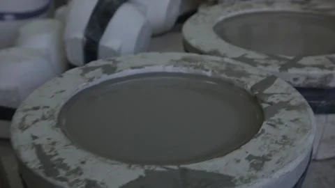 Clay workshop. Wooden shelf. Two forms for pouring clay for making dishes. Video stock 130526363
