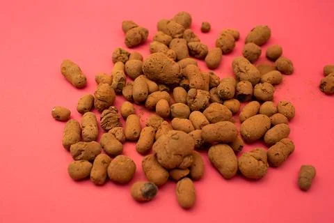 Claydite scattered on a bright background Stock Photos