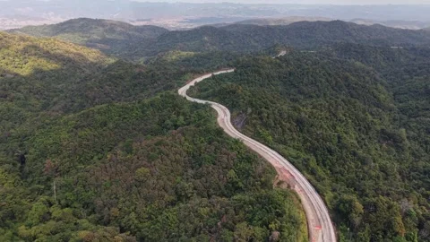 Clean Aerial Composition of a Winding Road in the High Mountains Video stock 327508336
