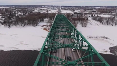 Clean aerial geometry of bridge over frozen river winter Stock Footage 329395527
