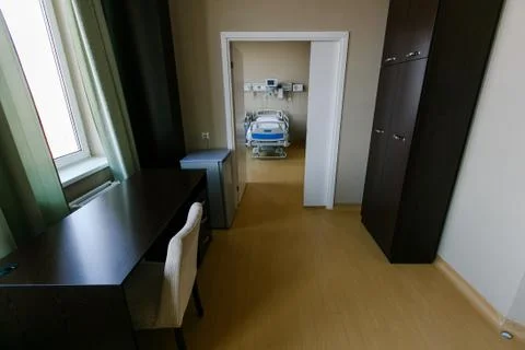 Clean and empty room with a new bed in the new medical center. Stock Photos