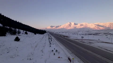 Clean and light traffic road on snow covered vast fiels, jk01 스톡 동영상 267730672