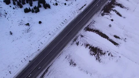 Clean and light traffic road on snow covered vast fiels, jk01 Stock Footage 267740589