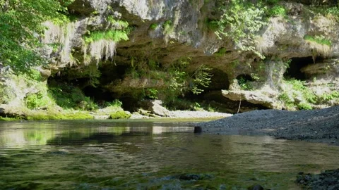 Clean and pristine river flows in narrow gorge Stock Footage 220600975