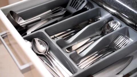 Clean and tidy kitchenware in a drawer in the kitchen Stock Footage 145434641