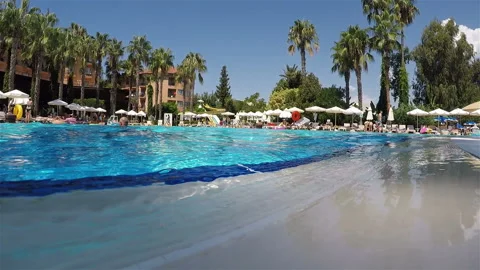 Clean and transparent water in the pool is drained through the edges into the Video stock 128443753
