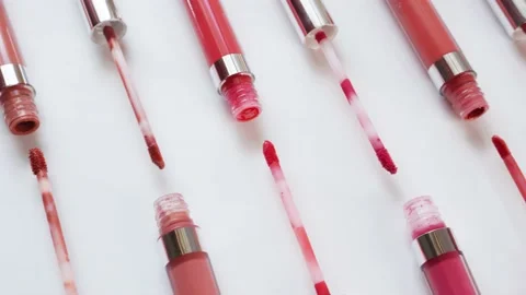 Clean artistic layout of open liquid lipsticks Stock Footage 187405157