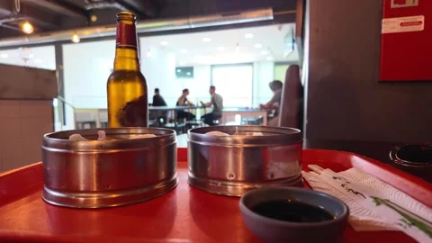 Clean asian market interior with empty table in foreground, soft lights, simple Stock Footage 307358610