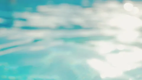 Clean azure water surface texture. Refraction of sunshine in swimming pool Stock Footage 328716216