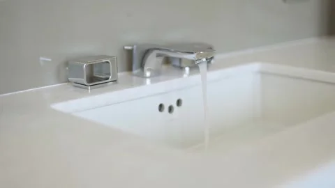 Clean bathroom with refreshing shower, reflecting mirror, and sleek tiles. Stock Footage 247925792