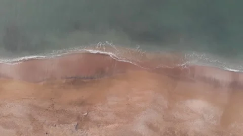 Clean beach with floating waves Video stock 245078340