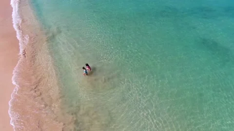Clean, beautiful ocean with white sand Stock Footage 138528401