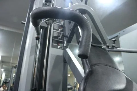 A clean black adjustable weight bench in a gym Stock Photos