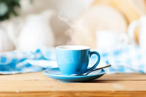 A clean blue cup in the kitchen. Mockup. Selective focus. Mock-up of a tea mug. Stock Photos