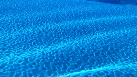 Clean Blue Water In The Swimming Pool. Ripple And Waves In Clear Water. Stock Footage 129727759