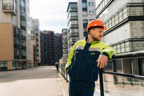 A clean builder shows sincere emotions of indignation. Man in special clothes Stock Photos