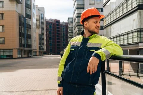 A clean builder shows sincere emotions of indignation. Man in special clothes Stock Photos
