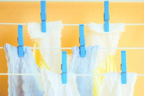 Clean clothes hanging on clothes drying rack clothesline Fresh and clean conc Stock Photos