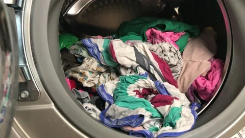 Clean colored laundry in the washing machine. Open door on the washing machine. Stock Footage 132636609