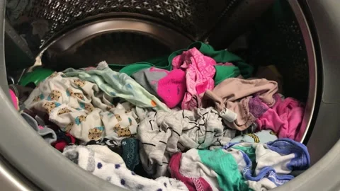 Clean colored laundry in the washing machine. Open door on the washing machine. Stock Footage 132636610