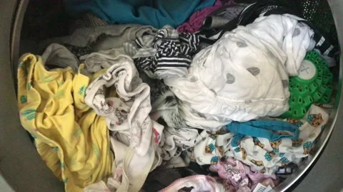 Clean colored laundry in the washing machine. Open door on the washing machine. Stock Footage 132636630