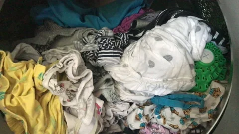 Clean colored laundry in the washing machine. Open door on the washing machine. Stock Footage 132636653