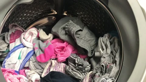 Clean colored laundry in the washing machine. Open door on the washing machine. Stock Footage 132874905