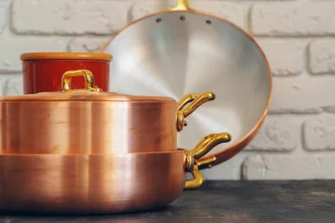 Clean copper cookware in kitchen close up Stock Photos