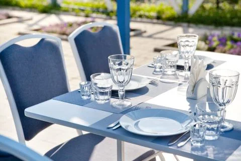 Clean Cutlery.table setting in summer cafe Stock Photos