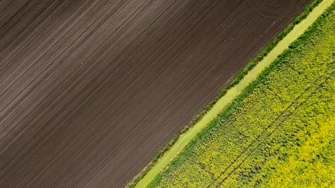 A clean diagonal top-down aerial drone photograph splitting the frame between Stock-Fotos